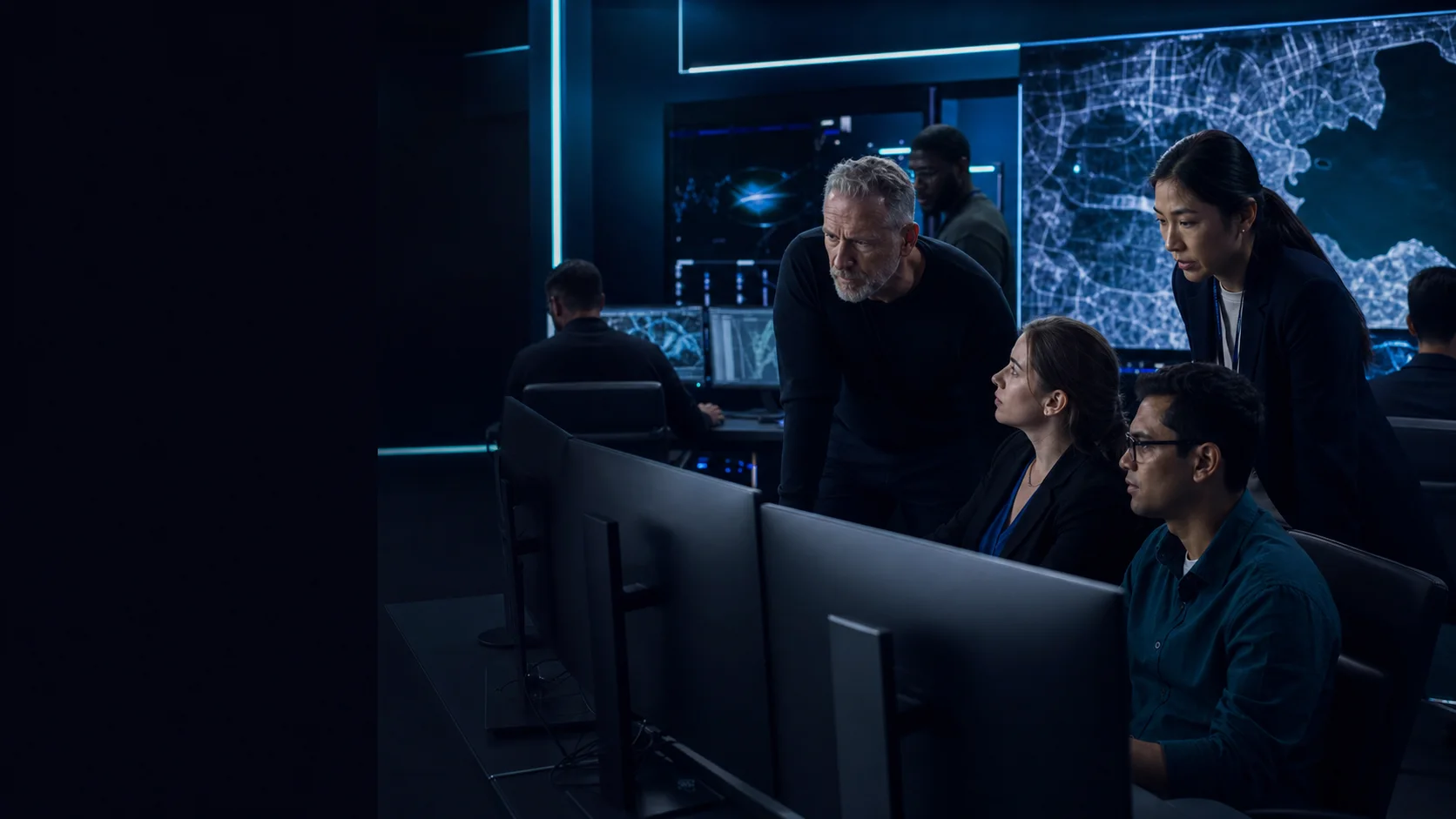 Geo Owl geospatial specialists collaborating in a mission operations center